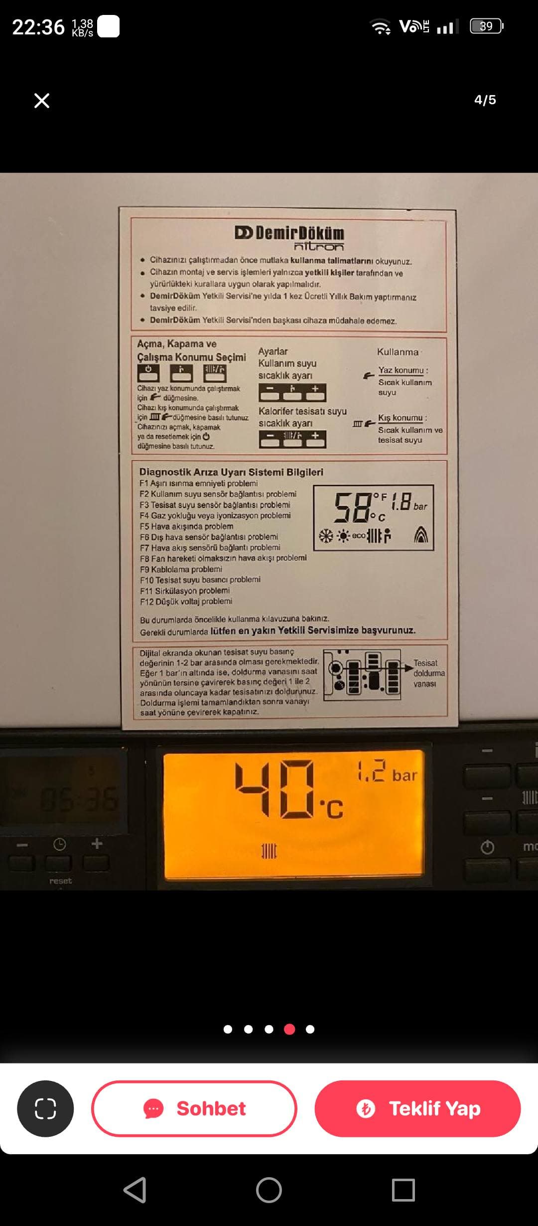 Boiler display showing 40°C and 1.2 bar below a Turkish instruction and error sticker.